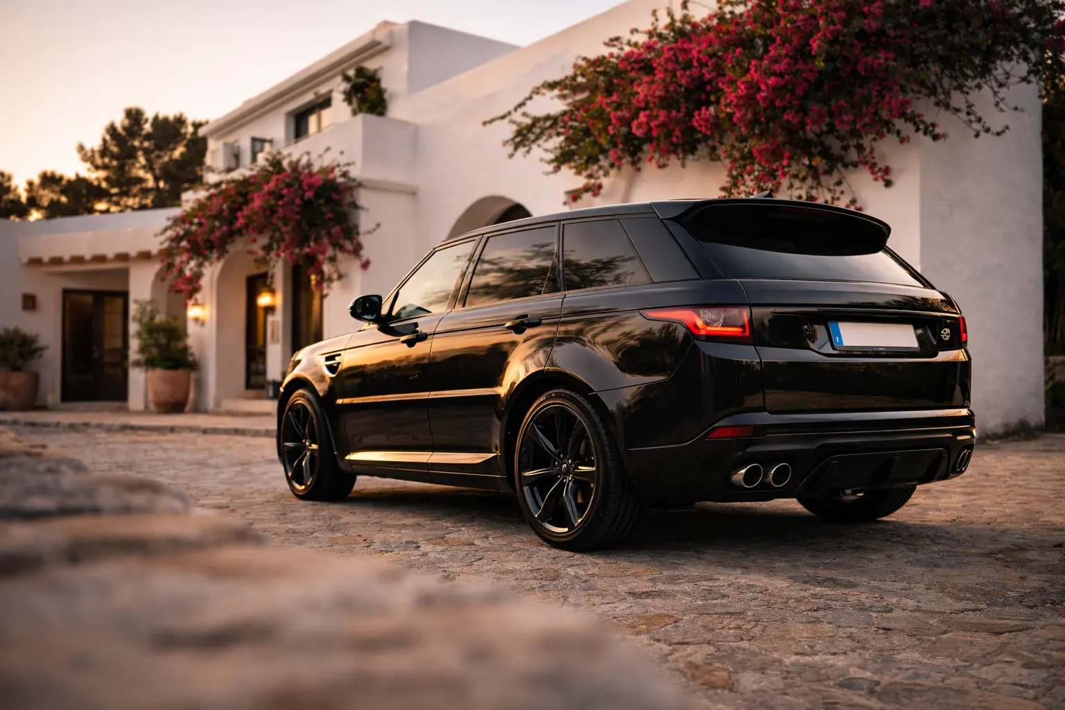 Luxury car rental Ibiza airport delivery — Range Rover Sport at IBZ airport golden hour